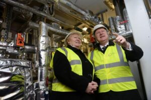 Former SNP minister Alex Neil unveiled a £10.6 district heating scheme, designed to help reduce the heating bills of more than 700 households in Glasgow, in January